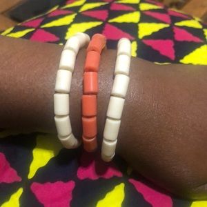 These are handmade cream/ beige and pink/ salmon bracelets with beads